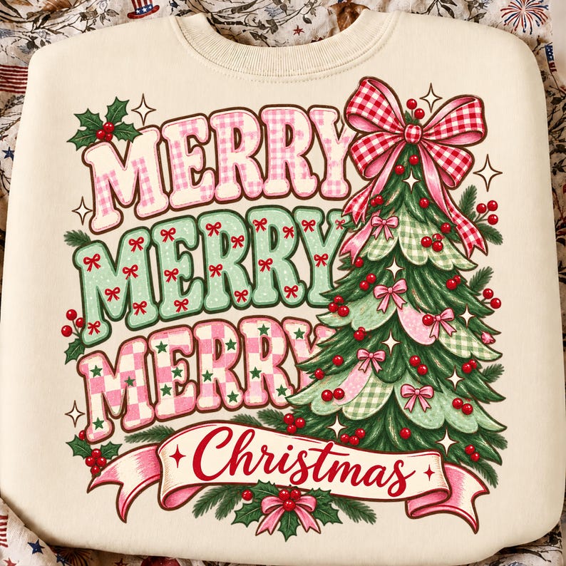 May include: A cream-colored sweatshirt featuring a graphic print with the text MERRY MERRY MERRY Christmas. The design includes a stylized green Christmas tree decorated with red berries, pink bows, and a large red and white gingham bow on top.