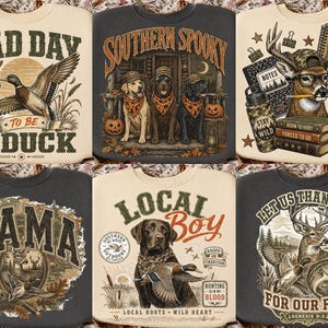 May include: A collection of six sweatshirts featuring graphic prints. Designs include a duck in flight, three dogs in bandanas, a deer with school supplies, a deer in a forest, a Labrador with a duck, and a deer with a fish and text.