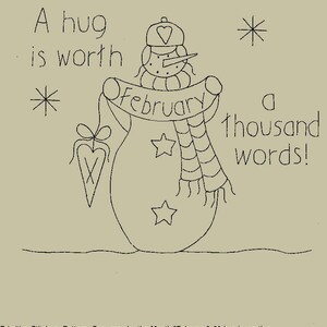May include: A black and white line drawing of a snowman with a hat and scarf, holding a banner that says "February". The text "A hug is worth a thousand words!" is also included. The image is a primitive stitchery pattern.