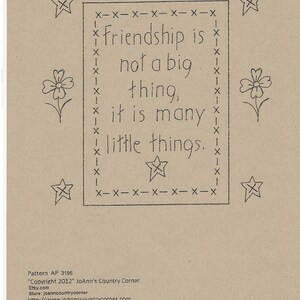 May include: A craft pattern on tan paper with the word "March" at the top. The text "Friendship is not a big thing, it is many little things" is inside a dotted border. Stars and flowers are drawn around the text.
