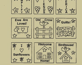 May include: A set of nine primitive stitchery patterns, each in a square frame. The designs include text like "Simplify," "Friends," and "America," along with images of a sheep, bird, and house. Stars and hearts are also featured.