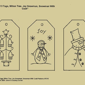 May include: Three black and white printable gift tags with a mitten tree, a snowman with the word "Joy" and a snowman with a coat. The text "Set of 3 Tags, Mitten Tree, Joy Snowman, Snowman With Coat! Patterns AP216" and "Copyright 2008 JoAnn's Country Corner" is printed below the tags.
