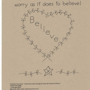 May include: A tan-colored print featuring the words "Primitive Vine Heart" and a quote about belief. A heart-shaped vine design surrounds the word "Believe". A star and decorative lines are at the bottom.