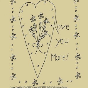 May include: A black and white embroidery pattern of a heart with a bouquet of flowers inside. The text "Love You More!" is written to the right of the heart. The pattern is surrounded by small flower designs.