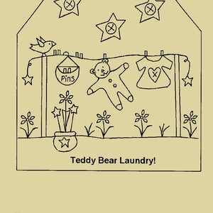 May include: A hand-drawn tag pattern with the text "Teddy Bear Laundry!". The design features a clothesline with a teddy bear, baby clothes, and stars. A bird sits on a clothesline pole. Flowers and a pot are at the bottom.