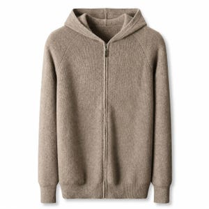 May include: A light brown, long-sleeved, full-zip hoodie made of a knit fabric. The garment features a hood, a central vertical zipper closure, and ribbed cuffs at the wrists and hem. The texture appears soft and consistent throughout the piece.