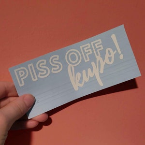 May include: A blue sticker with white lettering that says "PISS OFF, KRYPTO!"