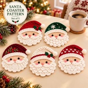 May include: A set of five crocheted coasters shaped like Santa Claus faces, featuring red and green hats with white pom-poms, pink cheeks, and black eyes. One coaster has a green hat with a white snowflake, while others feature holly berries.
