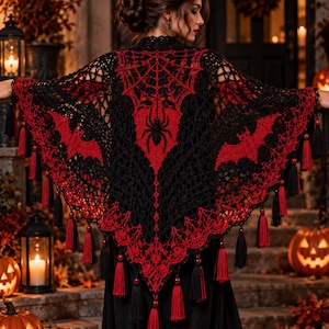 May include: A black and red crocheted shawl featuring a central spider and spiderweb motif, flanked by bat silhouettes on each side. The triangular garment is finished with a decorative openwork pattern and numerous hanging black and red tassels.