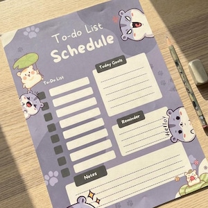 May include: A purple paper to-do list schedule planner featuring cartoon animal illustrations, paw prints, and sections labelled To-Do List, Today Goals, Reminder, and Notes. The text To-do List Schedule and Hello! is printed on the page.