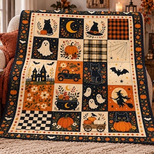 May include: A rectangular quilt featuring a patchwork design with Halloween-themed illustrations including black cats, pumpkins, ghosts, a witch on a broomstick, a haunted house, a truck, a cauldron, bats, and spiderwebs in orange, black, and cream.