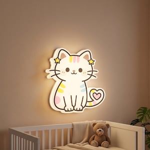 May include: A wall-mounted cat-shaped LED light fixture featuring a white feline with pastel-colored stripes on its head, back, and tail. The cat has two yellow star accents near its ears and a heart-shaped tip on its tail, emitting a soft glow.