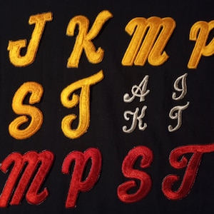 May include: Assortment of felt letters in various colors, including gold, silver, and red. The letters are in a cursive font style and are perfect for crafting projects.