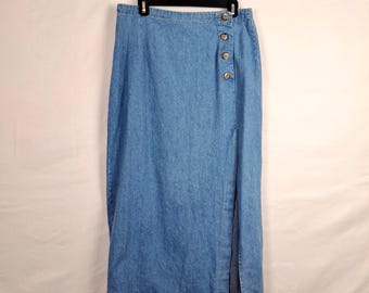 May include: A blue denim skirt with a side slit and button detailing.