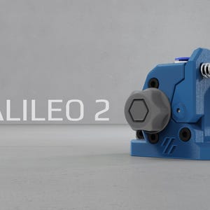May include: A blue 3D printed extruder assembly labeled GALILEO 2, featuring a grey hexagonal tension knob, a spring-loaded adjustment screw with a black circular cap, and visible black mounting bolts on a textured blue housing structure.