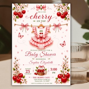 May include: A baby shower invitation card featuring a red and white cherry theme. The design includes a ruffled dress on a hanger, cherry blossoms, butterflies, and a basket of cherries. Text reads: She is the cherry on top, Baby Shower, Sophia Elizabeth, August 25, 3:00 PM, The Berry Cafe, 1284 Willow Creek Ln., Sunnyvale, CA 94087, RSVP to Sophia at 123-456-7890.