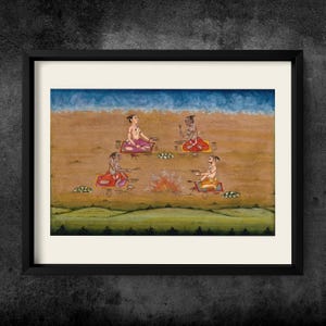 May include: A framed painting depicting four figures seated on mats around a central fire in a desert landscape. The figures wear colourful garments and hold small objects. The scene features a blue sky above a tan expanse and green hills below.