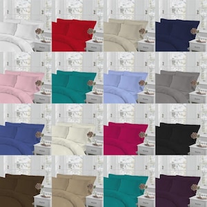 May include: A collection of sixteen bedding sets in various solid colors, each featuring a duvet cover and two matching pillowcases arranged on a bed frame with a headboard, displayed in a grid format to show the available color options.