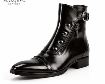 May include: A black leather ankle boot featuring a polished finish, a side zipper with a metallic pull, a silver-toned buckle strap at the ankle, and a row of decorative silver studs along the front. The brand name MARQEVO LEATHER is visible.