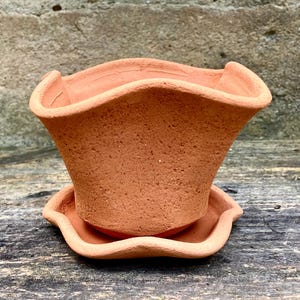 SMALL FLOWER POT #93. Fluted terracotta planter with saucer. Porous red clay.