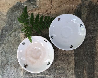 Set of Two Vintage Crazed and Stained Demitasse Saucers.
