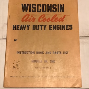 May include: A tan instruction manual for Wisconsin Air Cooled Heavy Duty Engines. The cover features the company logo and the text "Models TH, THD" and "Issue MM-277-C".