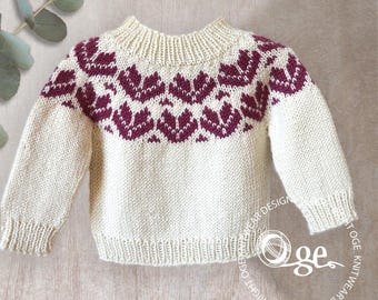 May include: Cream-coloured knitted jumper with a burgundy floral pattern across the chest and shoulders. The jumper has long sleeves and a ribbed neckline, cuffs, and hem. A classic, cosy style.
