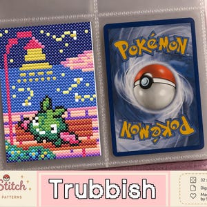 May include: A cross-stitch pattern of the green Pokémon Trubbish next to a standard Pokémon trading card inside a clear plastic binder sleeve. The pattern features a night scene with a street lamp, a bench, and a starry sky in pixelated style.