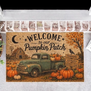 May include: A rectangular coir doormat featuring a printed scene of a vintage green pickup truck in a pumpkin patch. The text reads Welcome to our Pumpkin Patch with signs for Pumpkins, Hayrides, and Apple Cider. A barn, moon, and crow are visible.