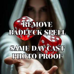 May include: Two translucent red six-sided dice with white pips floating above an open palm. The text REMOVE BADLUCK SPELL SAME DAY CAST PHOTO PROOF is overlaid in white with a black outline against a dark background.
