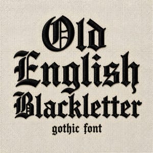 May include: Black embroidery on a light beige fabric background featuring the text Old English Blackletter in a large gothic font, with the words gothic font in a smaller, simpler black gothic typeface positioned directly underneath.