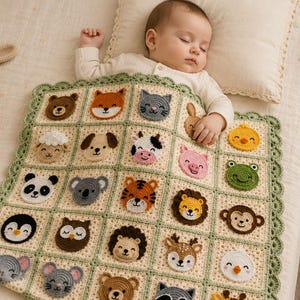 May include: A cream-colored crochet baby blanket featuring a grid of individual squares, each decorated with a different crocheted animal face, including a bear, fox, cat, sheep, dog, cow, pig, panda, koala, tiger, lion, monkey, penguin, owl, hedgehog, deer, chick, mouse, and raccoon, finished with a scalloped sage green border.