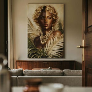 May include: A rectangular wall art print featuring a portrait of a person with curly blonde hair, split lighting across the face, and wearing a multi-layered pearl necklace and large pearl earrings, surrounded by large green and cream palm leaves.