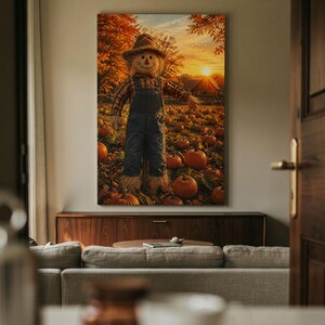 May include: A vertical wall art print depicting a scarecrow wearing a plaid shirt and denim overalls standing in a pumpkin patch at sunset. The scene features numerous orange pumpkins on the ground, autumn trees, and a house under a golden sky.