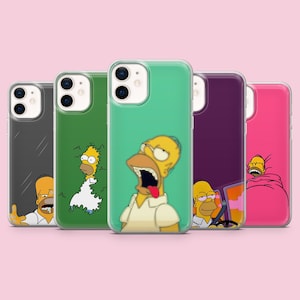 May include: A collection of five clear smartphone cases featuring various illustrations of Homer Simpson. The designs include Homer emerging from a hedge, Homer with his mouth wide open, Homer driving a car, and Homer sleeping under a pink blanket.