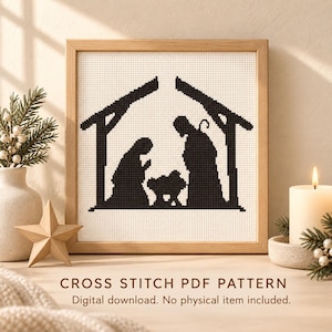 Könnte beinhalten: Ein Kreuzstichmuster mit einer schwarzen Silhouette einer Krippenszene in einem Stall, gerahmt in hellem Holz. Der Text lautet CROSS STITCH PDF PATTERN. Digital download. No physical item included.