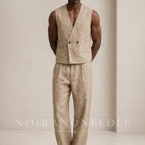 May include: A beige double-breasted vest and matching pleated trousers set. The vest features a V-neckline and two dark buttons. The trousers have a straight-leg cut. The text NOIRANDNEEDLE is visible at the top left and bottom center.