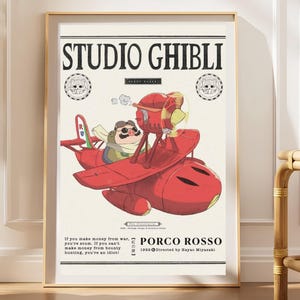 May include: A framed poster featuring Studio Ghibli's Porco Rosso. The artwork displays a red seaplane piloted by a pig character wearing goggles. Text includes 'STUDIO GHIBLI', 'PORCO ROSSO', and a quote about bounty hunting in black lettering.