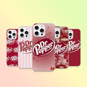 May include: Five smartphone cases featuring Dr. Pepper branding. The first is dark red with white logos, the second has pink stripes and a bow, the third is a gradient pink with a central logo, the fourth has a red lip print, and the fifth is solid red.