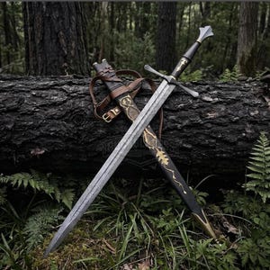 May include: A double-edged steel sword with a patterned blade, a black grip, and a crossguard. The sword is paired with a black scabbard featuring gold-colored leaf-shaped metal accents and brown leather straps with a metal buckle for carrying.