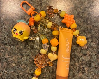 Peachy Shopkin sleutelhanger + E.l.f Squeeze Me lippenbalsem - Perzik