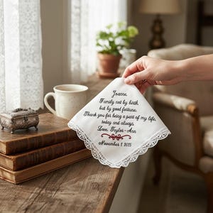 A beautiful white lace handkerchief with  embroidered text that reads: “Family not by birth, but by good fortune. Thank you for being a part of my life. today and always.” a perfect gift for a stepmother of the bride or groom! measures 12” x 12”. 100 % cotton. hand wash. lay flat to dry.