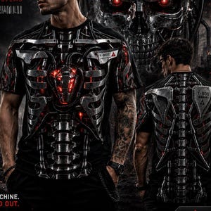 May include: A black t-shirt featuring a detailed graphic print of a metallic T-800 endoskeleton with glowing red accents on the front and back. The design includes the text T-800, Cyberdyne Systems, and Built Like A Machine. Made To Stand Out.