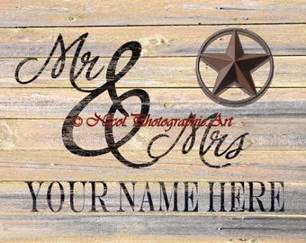 May include: A rustic wooden sign with the words "Mr & Mrs" in a black cursive font. A brown metal star with a circle around it is above the text. The words "YOUR NAME HERE" are below the text.