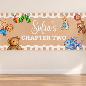 May include: A rectangular banner with a tan background and white scalloped borders, featuring the text Sofia's CHAPTER TWO. Illustrations include a caterpillar, a mouse with a cookie, a teddy bear, a rabbit, a monkey with a red balloon, and a fish.