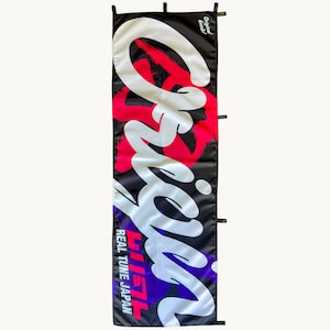 May include: A rectangular black banner featuring the large white text Origin in a stylized script font. The design includes red and purple abstract shapes, with the text Original Goods and REAL TUNE JAPAN printed in white and red.
