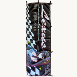 May include: A vertical black banner featuring a checkered pattern on the left side, the text Lexus, Relentless pursuit of perfection, and Japanese characters. It displays an anime-style character with long black hair and red eyes.