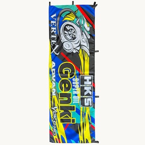 May include: A rectangular vertical banner featuring a vibrant graphic design with blue, yellow, red, and black colors. The text includes VERTEX, ADVAN, YOKOMO, Genki, SUPER OIL, and HKS, alongside a stylized illustration of a turbocharger component.