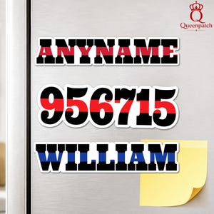 May include: Three rectangular decals with white borders. The top decal displays the text ANYNAME in black with a horizontal red stripe. The middle decal shows the number 956715 in black with a red stripe. The bottom decal shows WILLIAM in black with a blue stripe.