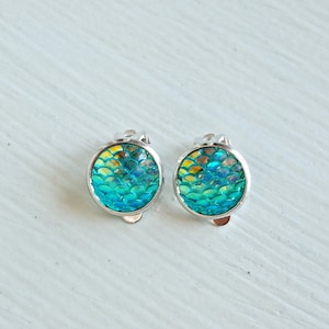 Mermaid aqua clip on earrings. Little girl's blue green sparkly scale iridescent clip on earrings.